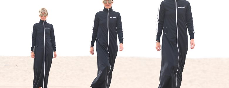 Laura dunn poses in a triptych in palm angels athleisure full body duster in black in Santa Monica beach on a cloudy day