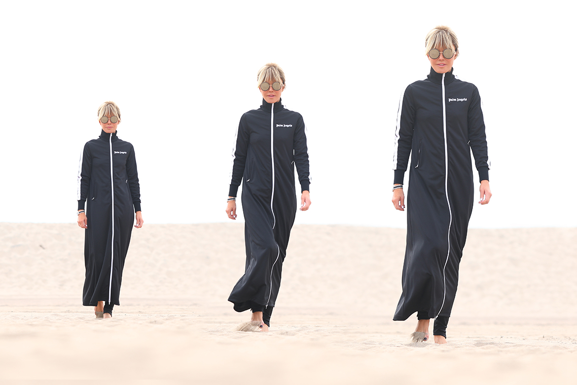 Laura dunn poses in a triptych in palm angels athleisure full body duster in black in Santa Monica beach on a cloudy day
